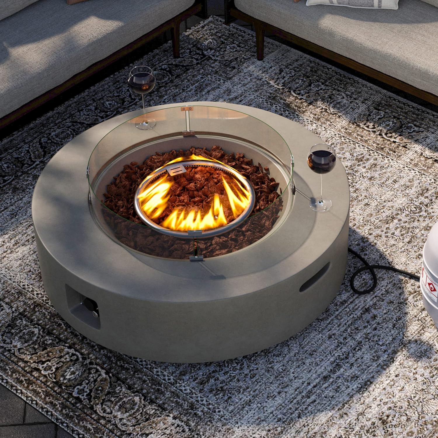 SUNBURY Outdoor Propane Burning Fire Pit, Circular Gray Patio Fire Table 50,000 BTU w Lava Rocks, Glass Wind Guard, Waterproof Cover